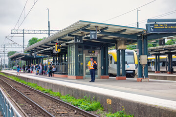 People waiting for the train on a platform