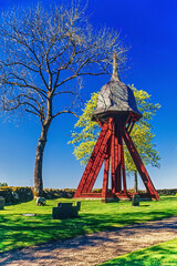 Red belfry in a cemetery