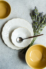 Ceramic tableware on concrete table background