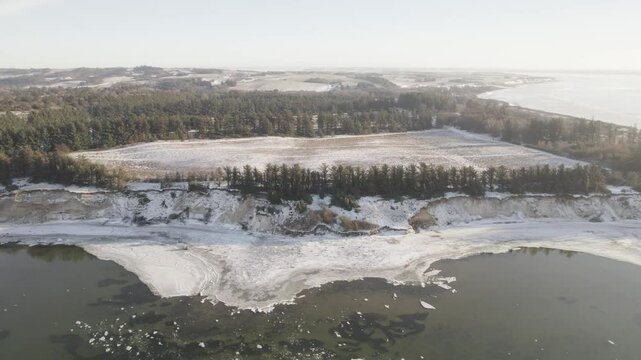 Shot Of A Lonely Man Standing By A Cliff Near The Ocean