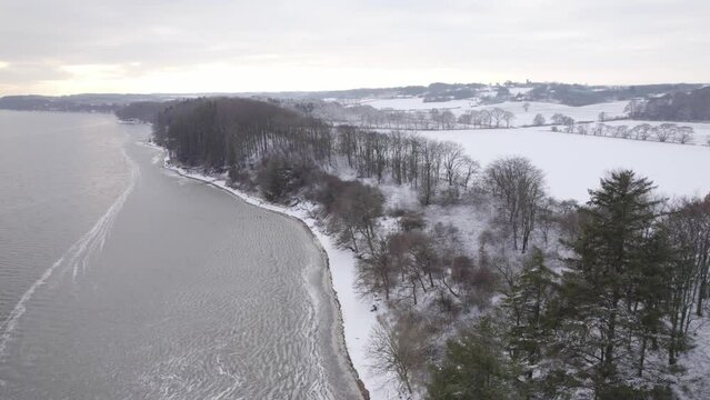 Shore of the Limfjord In Denmark Under The Snow - Aerial Drone Shot