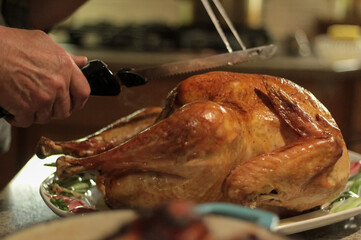 Carving the holiday turkey, festive dinner moment