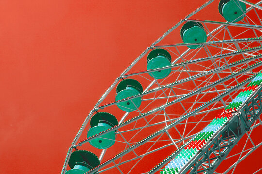 Green and red  toned picture of a Ferris wheel