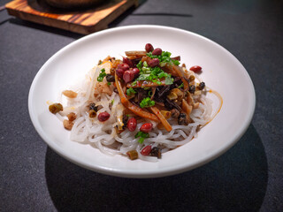 A dish of dry mixed Luosifen snail noodles, it is a renowned specialty from Liuzhou, a city in Guangxi, China. This unique and flavorful dish from local eateries boasts an special taste and aroma.