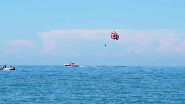 Thrilling parachute boat flight over the ocean, an unforgettable adventure