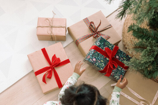 Toddler Unwrapping Holiday Christmas Gifts