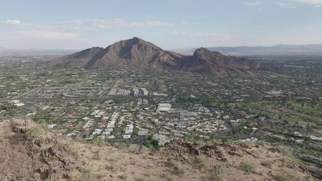 Drone view of Paradis Valley with wealthy houses and camelback mountains at background in Arizona, USA.