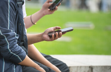 Man using smartphone in outdoors.