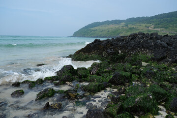 Volcano rocks and coral sand at Beach of Jeju Island at Jeju-do, South Korea