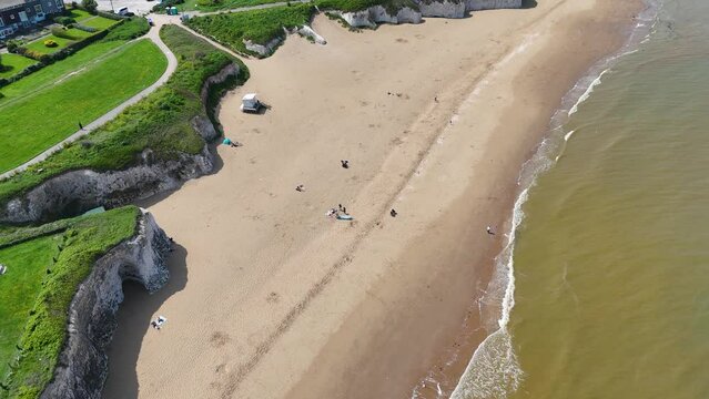 Botany Bay Beach in Broadstairs, Kent. Drone footage of the beach, bay, sea and chalk cliffs. Filmed on a sunny day in May. 