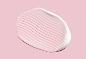 cosmetic smear of creamy texture on a light pink background