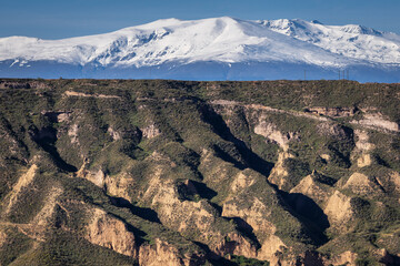 Las Majadillas, Gorafe desert, Gor river valley, Sierra Nevada in the background, Granada Geopark, Granada province, Andalusia, Spain