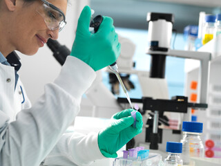 Biotech Research, Scientist pipetting sample into a vial ready for analysis during a experiment in the laboratory