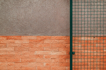 Abstract background, exterior wall of and building and metallic netting gateway