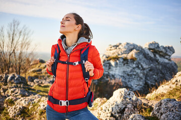 Woman on a hiking trip in the mountains having a break