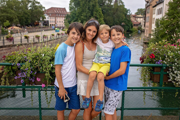 Beautiful family with children, boys, visiting Strasbourg during summer vacation