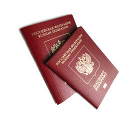 Two red russian foreign passports over white background studio shot close-up view