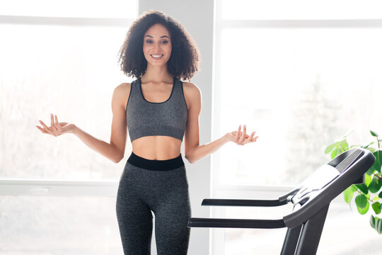 Photo of lovely adorable confident girl trainer promoting gym lessons exercises daylight indoors