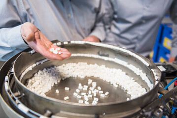Close-up of man holding outcome of a machine
