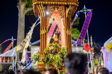 Thai people holding flower basket worship Chiang Mai City Pillar Inthakin Festival, crowd buddhist...