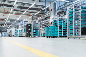 Stacked containers inside modern factory warehouse, Stuttgart, Germany