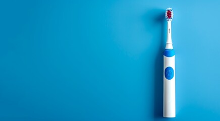 Naklejka premium Electric toothbrush on a plain bright blue background. This image portrays a modern dental care tool. The minimalistic style highlights the simplicity and practicality. Useful for health themes