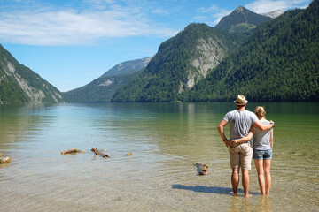 Germany, Bavaria, Koenigssee, couple standing in lake