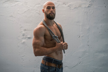 Portrait of a barechested athlete with rope