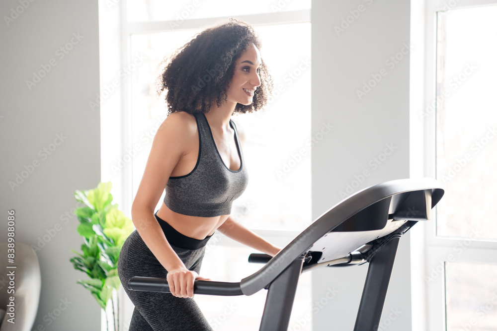 Sticker Photo of lovely adorable cheerful active girl coach walk treadmill physical exercises in gym daylight indoors