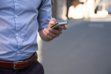 Close-up of businessman holding cell phone