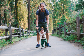 USA, California, Father and baby visiting Sequoia National Park