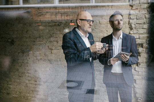 Senior and mid-adult businessman having a meeting