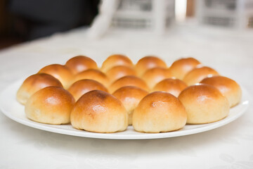 Closeup shot of bread rolls on a white plate