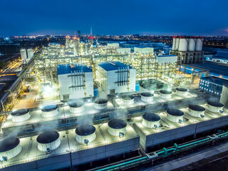 Oil refinery and chemical plant industrial buildings at night