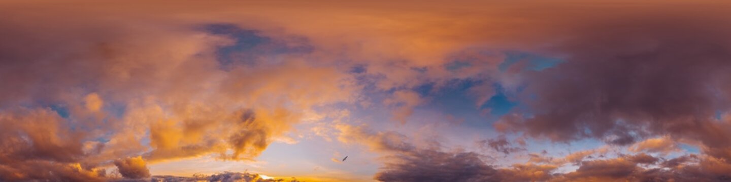360 panorama of glowing sunset sky with bright pink Cumulus clouds. HDR 360 seamless spherical panorama. Full zenith or sky dome sky replacement for aerial drone panoramas. Climate and weather change.
