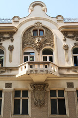 The balcony on the elaborate facade of the Aron Levi Trading house, surrounded by ornaments and...