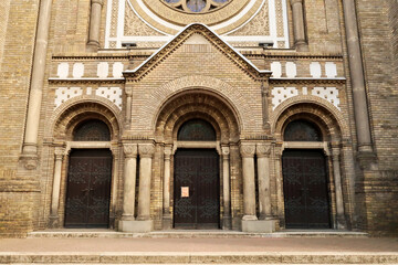 The elaborate facade of the Synagogue of Novi Sad around its main entrance door, decorated with...