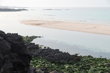 View of the sand beach on a cloudy day
