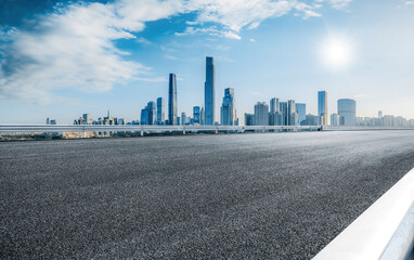 Empty asphalt road and modern city skyline background in Guangzhou