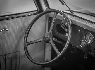 Dashboard and steering wheel of old-timer car