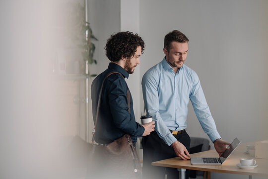 Two businessmen having a meeting in a coffee shop