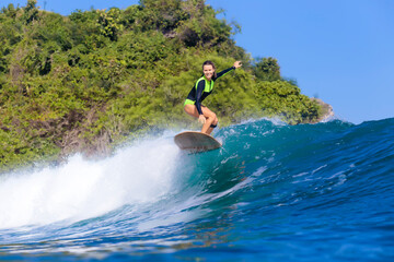 Indonesia, Bali, woman surfing