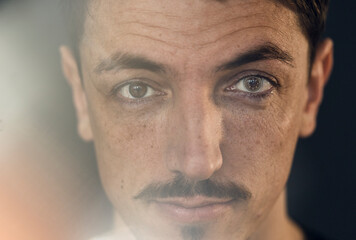 Portrait of brunette man with lens, cyborg