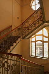 Obraz premium Stairwell, staircase inside the Menraths, Menrats Palace with elaborate handrails and stained glass windows, an example of Art Nouveau architecture in the city center, old town of Novi Sad, Serbia