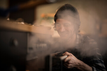 Man opening steaming oven in his kitchen