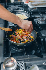 Chef preparing a dish in restaurant kitchen