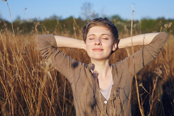 Portrait of smiling woman relaxing in nature