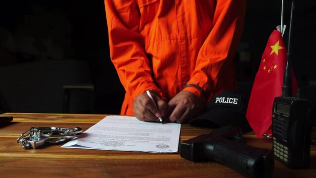 Detectives and prisoner in dark interrogation room