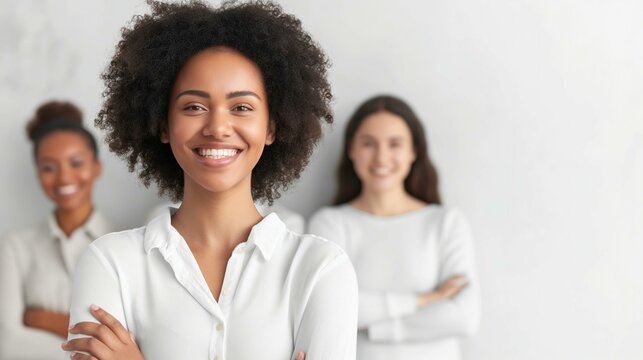 Smiling Businesswoman with Colleagues in Background - Teamwork and Success Concept
