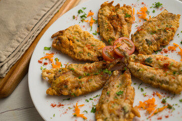 Tapa of anchovies battered with flour and egg in a Spanish restaurant. Traditional tapa of Spanish...